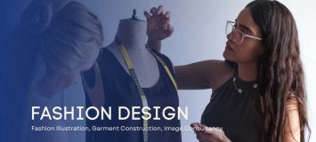 Two female fashion designers examining a shirt on a mannequin.