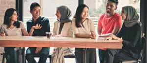 young adults friends gathering at cafe Group of smiling international students.