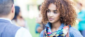 book-a-tour Female college student visiting a college campus.