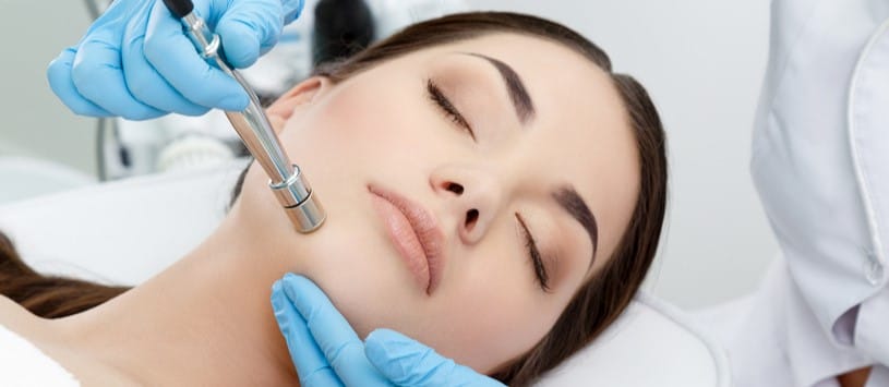 Microdermabrasion Certificate. Female client receiving a microdermabrasion treatment.