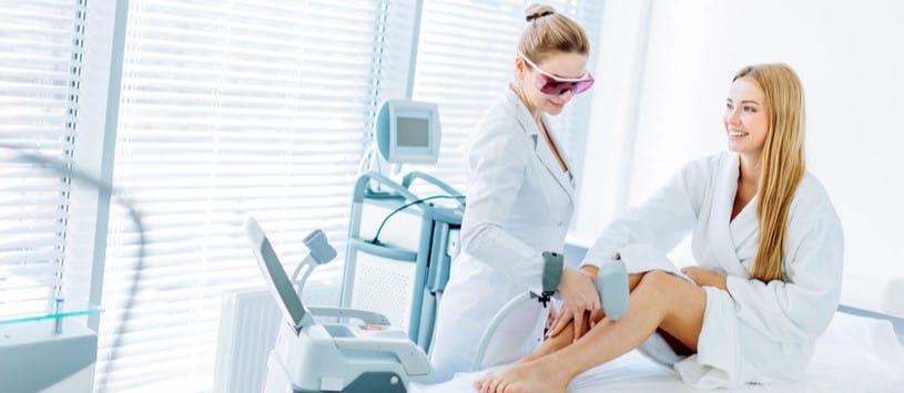Laser Hair Removal Certificate. Female client receiving a laser hair removal treatment on her legs.